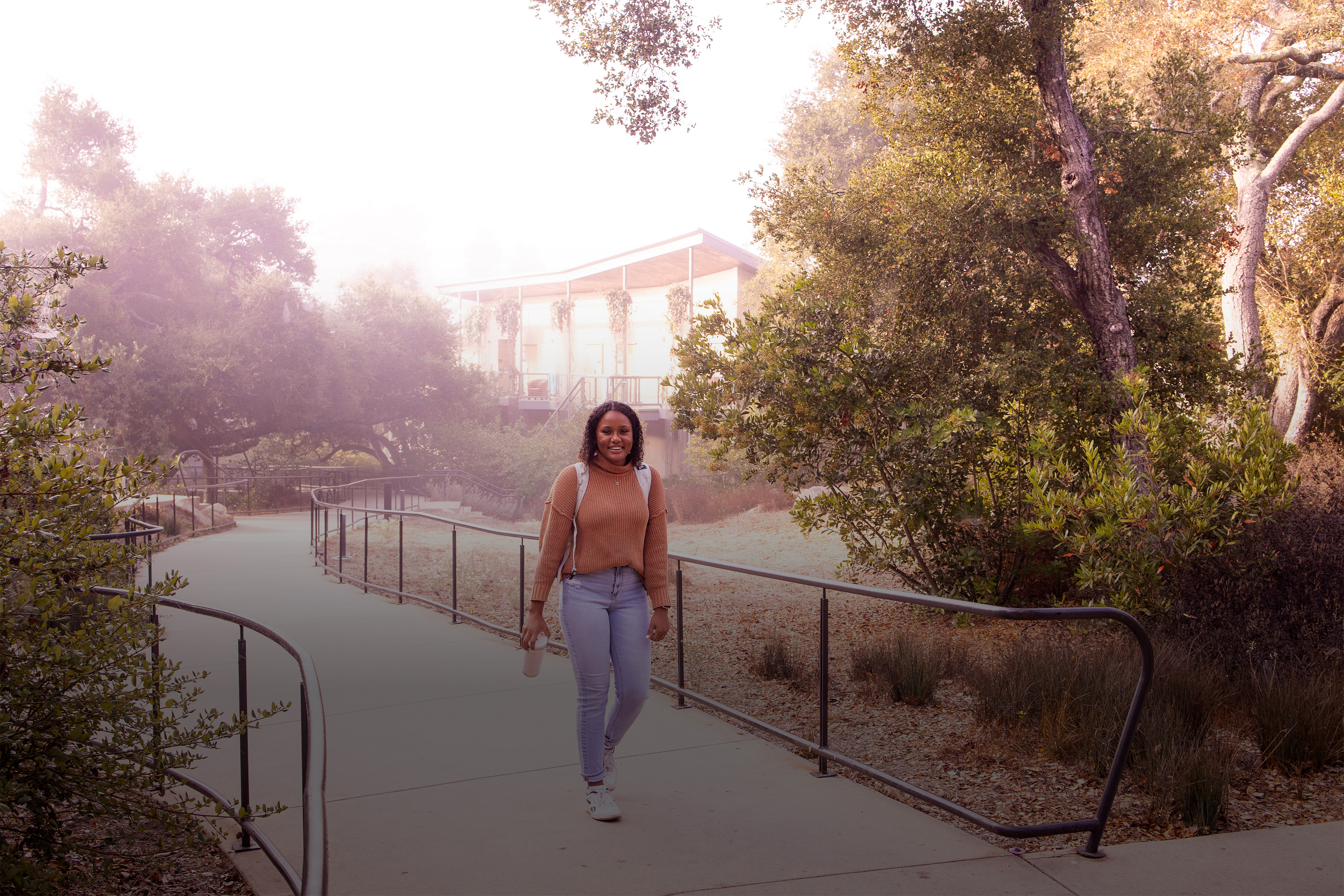 woman walking on westmont campus in the morning fog