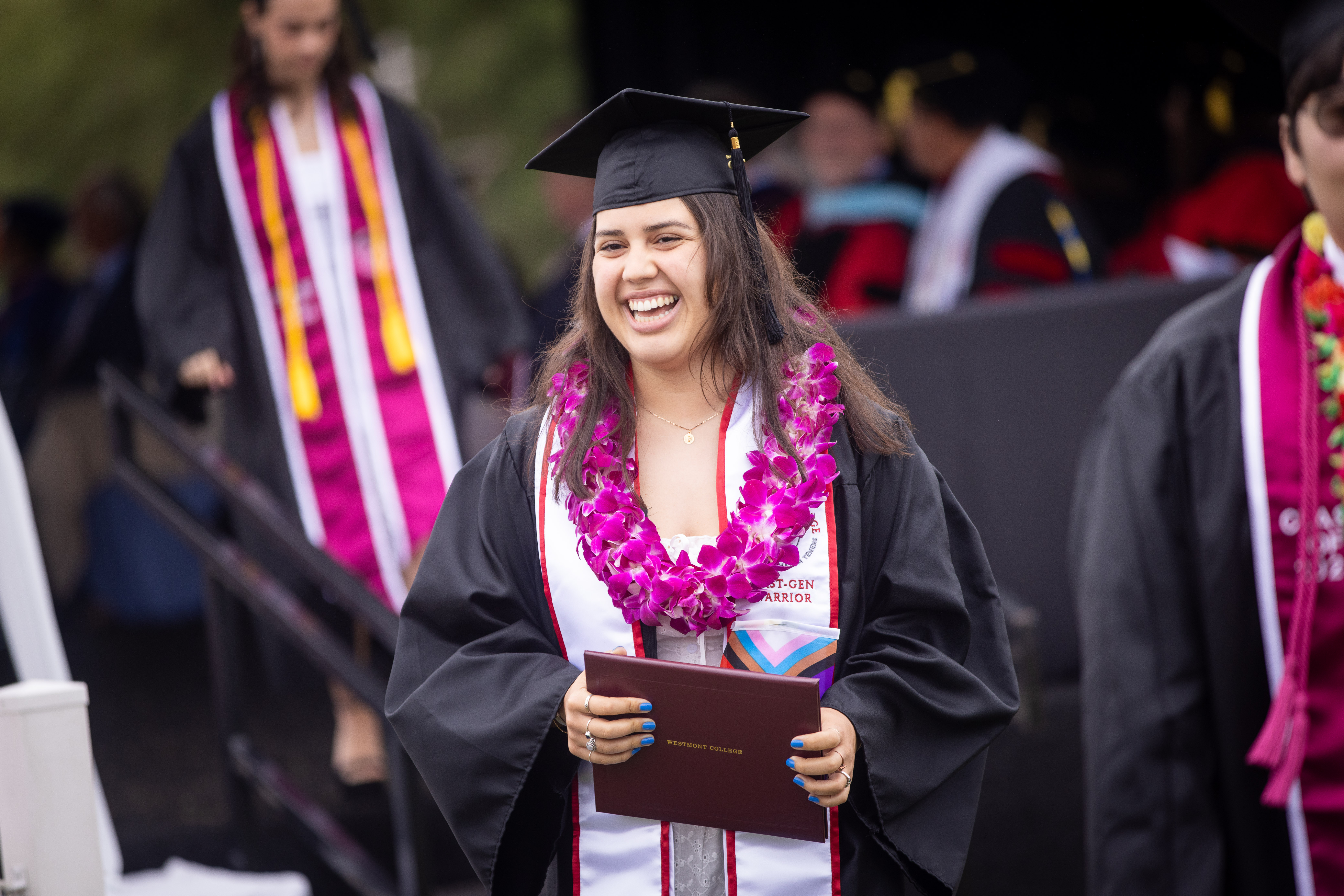 graduate smiling at 2025 westmont commencement