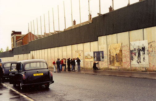 Westmont students read and sign the "peace wall" in Belfast, Northern Ireland