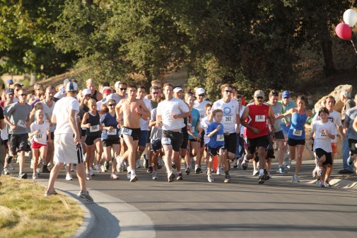 Runners bolt from the start of the Westmonster 5K race