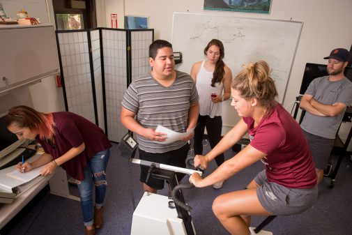 Student researchers Danielle Costa, Tyler Salinas and Sarah McGough work with Dr. Tim Van Haitsma to evaluate student Jae Ferrin