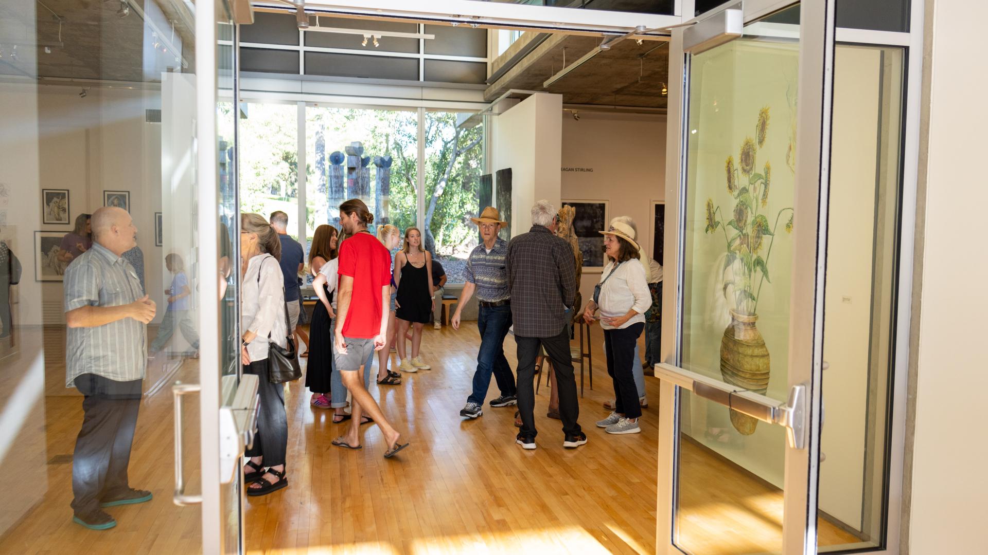 Visitors enjoying Lines of Inquiry reception.