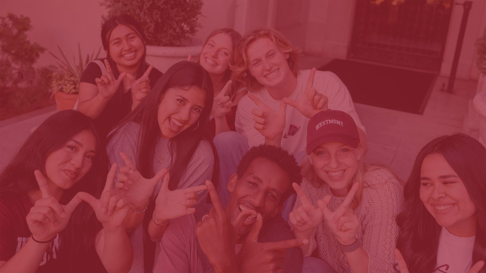 students showing westmont warrior sign