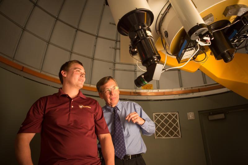 Student and professor in observatory